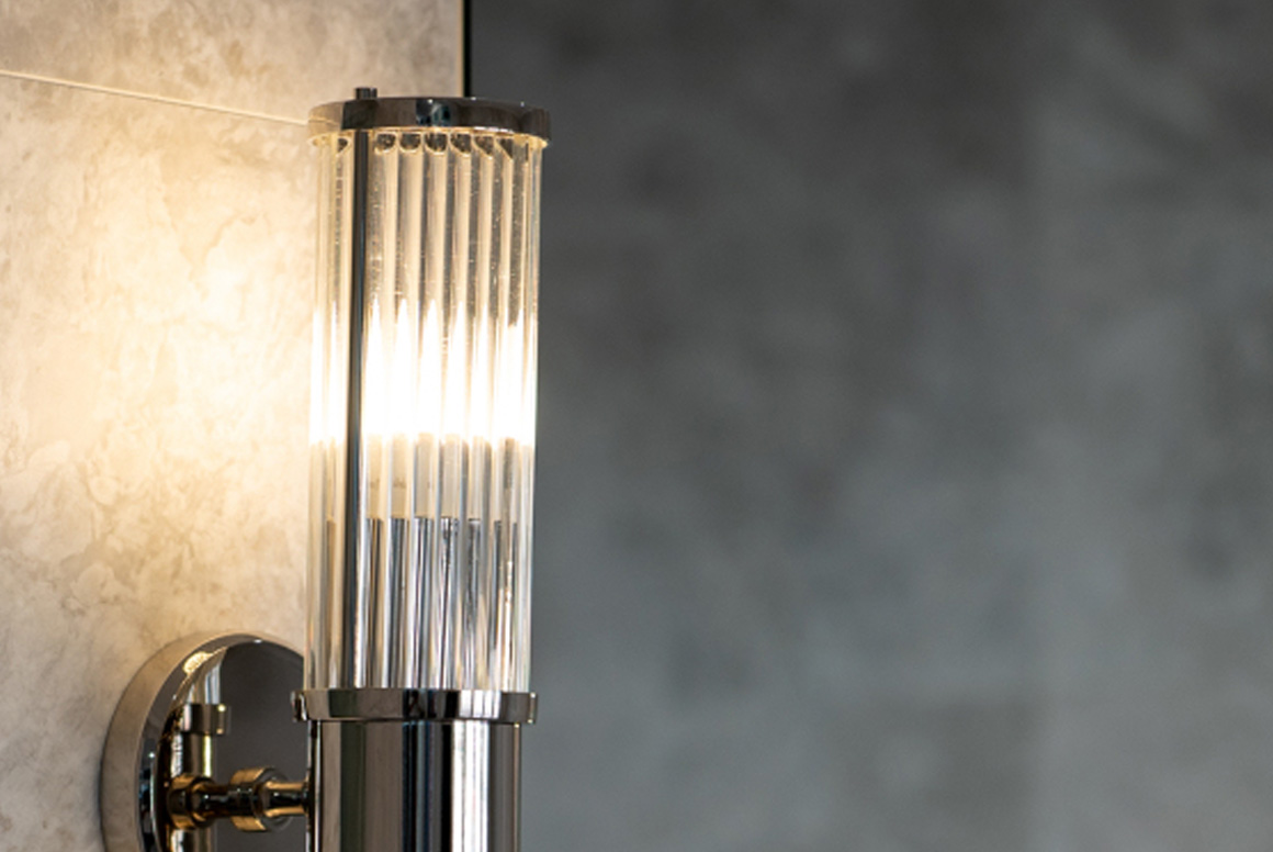Steel light on marble wall inside a modern luxury home by Perth boutique home builder Trendsetter Homes.